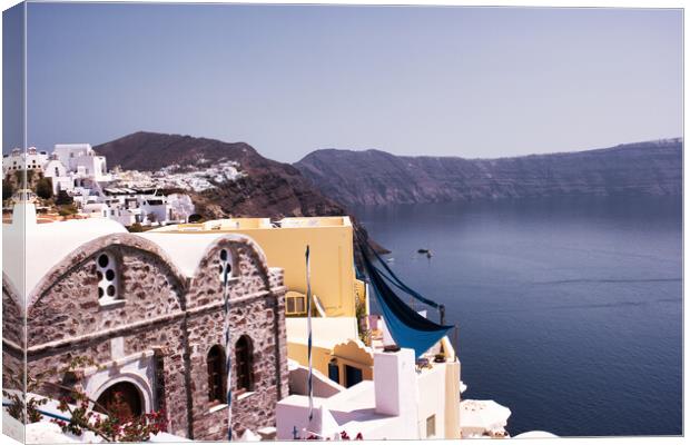 Santorini, Greece : Oia on the cliff line of the Caldera, Santorini, Cyclades situated on volcanic mountain in Geek famous island. Canvas Print by Arpan Bhatia