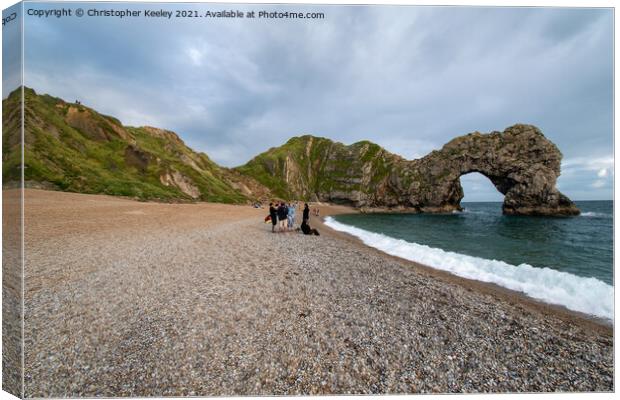 Durdle Door and tourists Canvas Print by Christopher Keeley