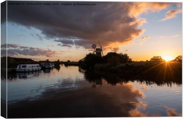 Sunset at Norfolk Broads windmill Canvas Print by Christopher Keeley