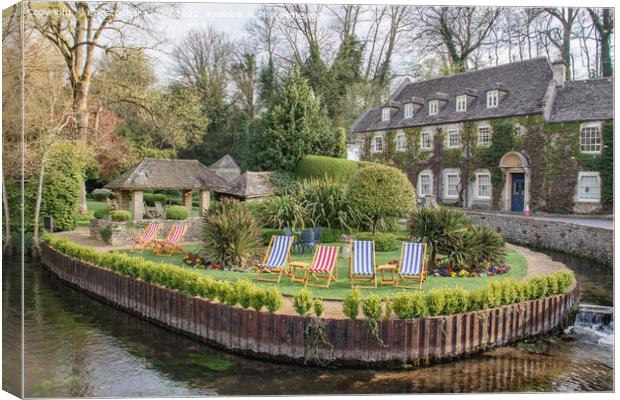 Cotswolds hotel and deck chairs in Bibury Canvas Print by Christopher Keeley