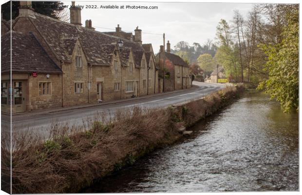 Cotswolds cottages and River Coln in Bibury Canvas Print by Christopher Keeley
