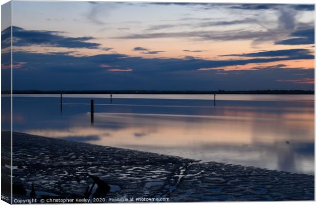 Sunset over Breydon Water Canvas Print by Christopher Keeley