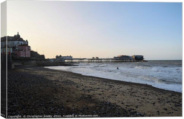 Cromer pier and beach at golden hour Canvas Print by Christopher Keeley