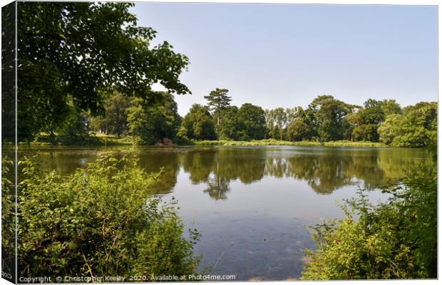 Summer at Holkham lake Canvas Print by Christopher Keeley