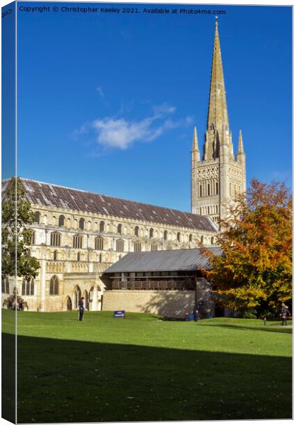 Sunny autumn day at Norwich Cathedral Canvas Print by Christopher Keeley