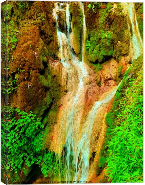 A waterfall flowing over rocks at Mudal river. Canvas Print by Hanif Setiawan
