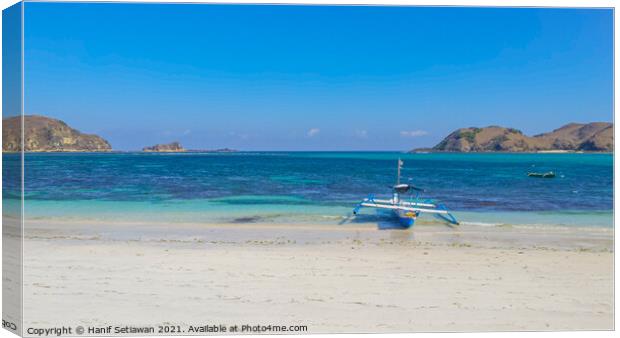 Paradise lagoon beach with boat at Tanjung An. Canvas Print by Hanif Setiawan