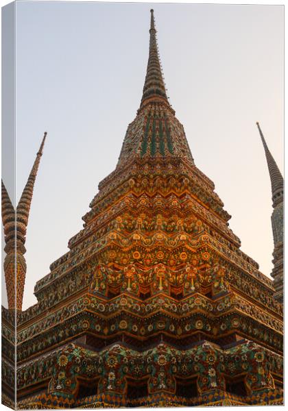 One Buddha stupa reaching in the clear sky. Canvas Print by Hanif Setiawan