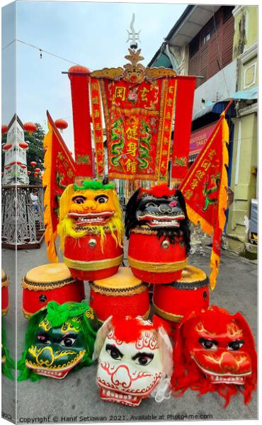 Chinese dragon masks drums and flags Canvas Print by Hanif Setiawan