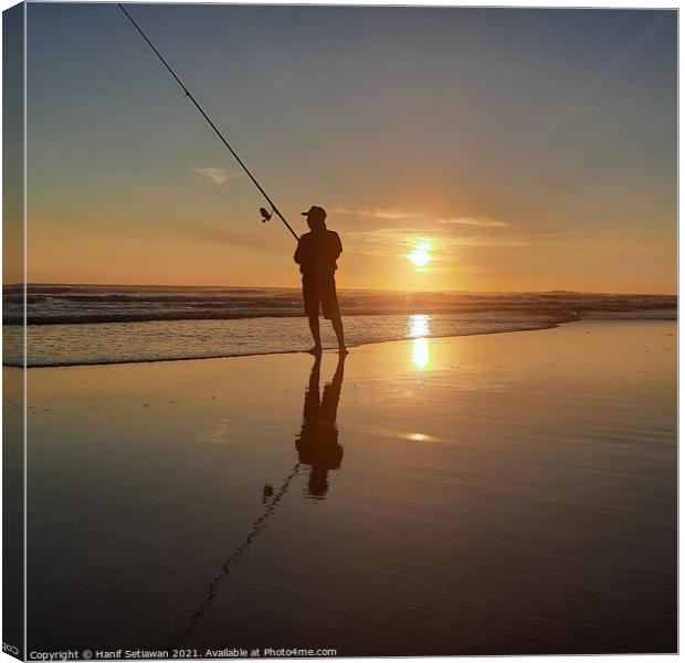 Fisherman on sand beach at sunset Squared Canvas Print by Hanif Setiawan