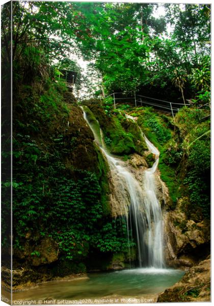 Rain forest waterfall Mudal Canvas Print by Hanif Setiawan