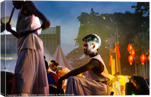 Young drummer performer on a culture festival. Canvas Print by Hanif Setiawan