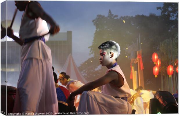 Young drummer performer on a culture festival. Canvas Print by Hanif Setiawan