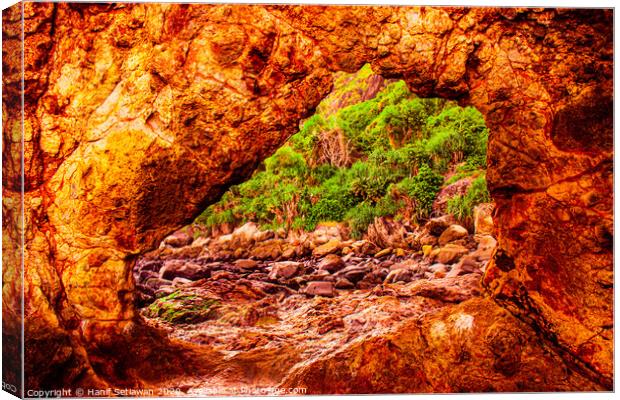 rock archway on fire Canvas Print by Hanif Setiawan