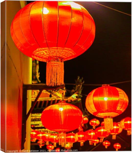 Red lantern as street lights hanging at a wall for Chinese New Year Canvas Print by Hanif Setiawan