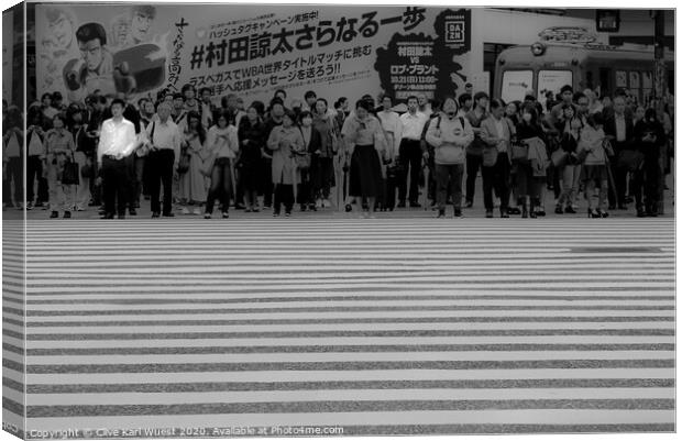 The man in the white shirt. Shibuya crossing Tokyo Canvas Print by Clive Karl Wuest