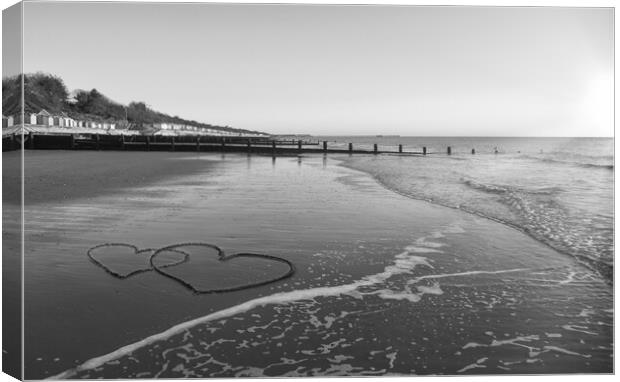 Hearts in the sand at Frinton-on-Sea Canvas Print by Paula Tracy