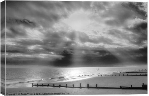 Sun rays streaming through clouds at Frinton beach Canvas Print by Paula Tracy