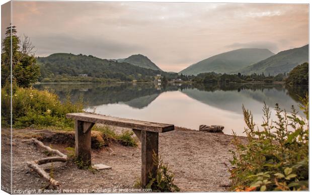 Grasmere wooden seat at Sunrise Canvas Print by Richard Perks