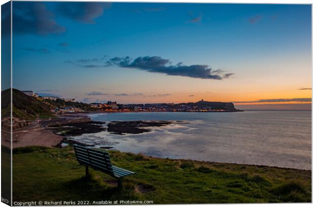 Watching the sunrise over Scarborough Canvas Print by Richard Perks