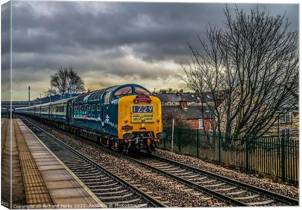 Preserved Deltic locomotive under storm clouds Canvas Print by Richard Perks
