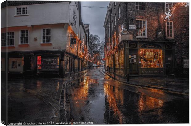 Rainy reflections in the streets of York Canvas Print by Richard Perks