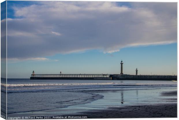 Whitby Pier reflections Canvas Print by Richard Perks