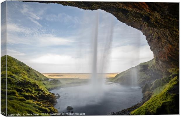  Seljalandsfoss Waterfall view from behind in Icel Canvas Print by Pere Sanz