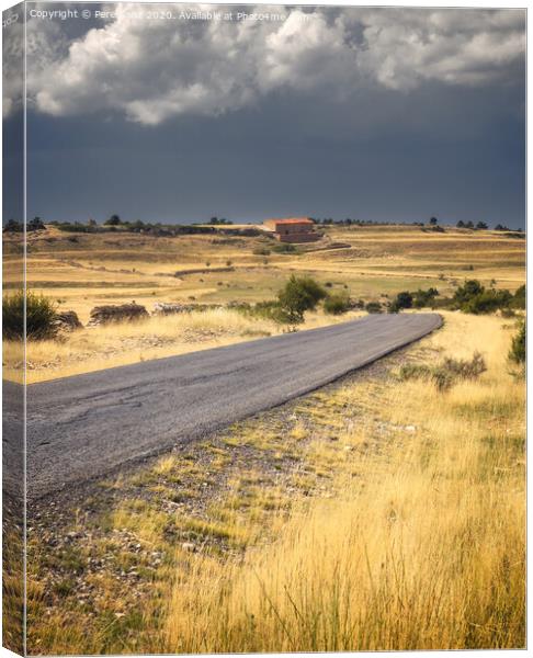 Road Across a Countryside Scene Under Stormy clouds Canvas Print by Pere Sanz