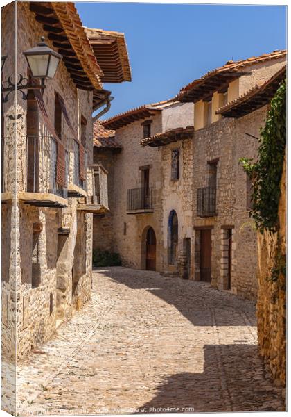 Beautiful Cobbled Street in the Medieval Village of Mirambel, Teruel, Aragon, Spain Canvas Print by Pere Sanz