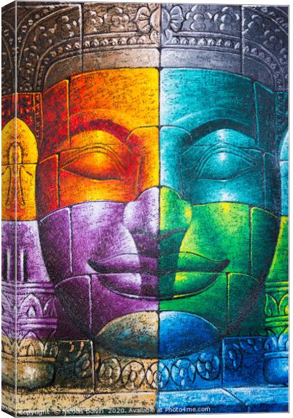 Colored cambodian buddha face Canvas Print by Nicolas Boivin