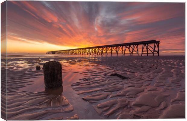 Sunrise over the pier Canvas Print by Kevin Winter