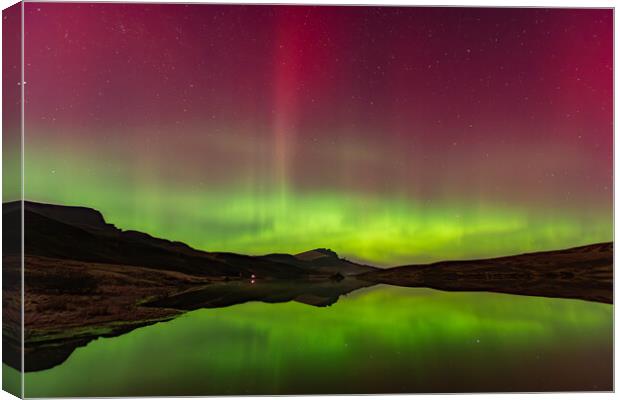 The Northern Lights reflected in Loch Fada Canvas Print by Kevin Winter