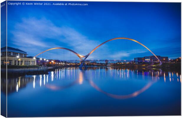 Tranquil Reflections of the Infinity Bridge Canvas Print by Kevin Winter