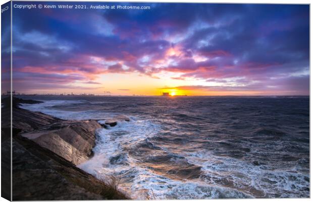 The Sun setting over a stormy South Gare Canvas Print by Kevin Winter