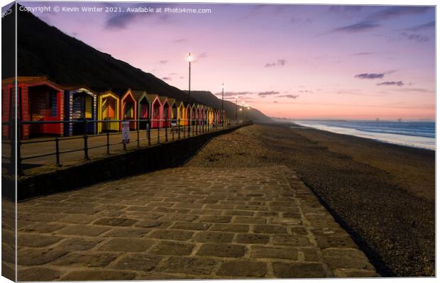 Beach Huts at sunset Canvas Print by Kevin Winter