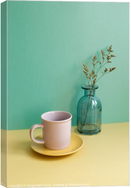 Coffee cup and dry flower Canvas Print by Sanga Park