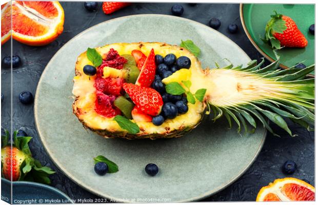 Fruit salad in half a pineapple, vegan concept. Canvas Print by Mykola Lunov Mykola