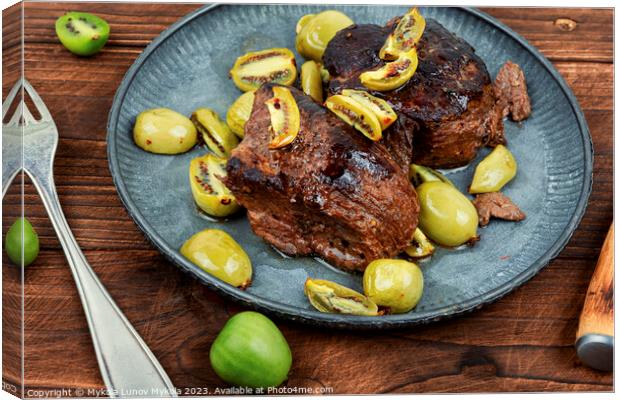 Fried ostrich steak with kiwi sauce Canvas Print by Mykola Lunov Mykola