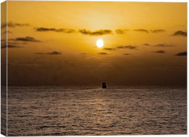 Ship Sailing into Sunset Canvas Print by chris hyde