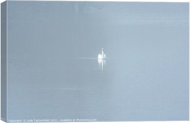A Swan gliding through the mist Canvas Print by Julie Tattersfield