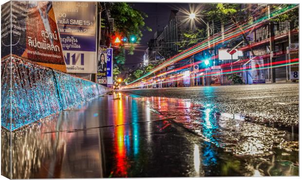Rainy Night a few days before election in Bangkok Canvas Print by peter kellfur