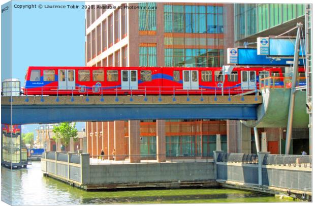 Docklands Light Railway train at Heron Quay Canvas Print by Laurence Tobin