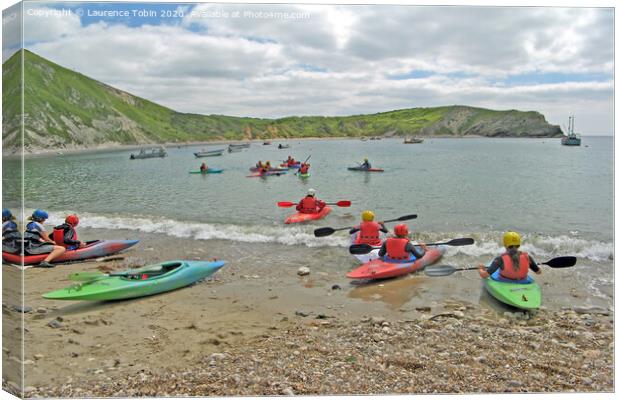 Canoes at Lulworth Cove, Dorset Canvas Print by Laurence Tobin