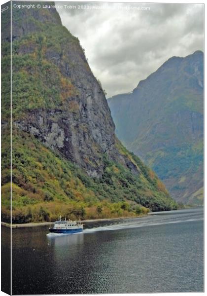 Boat in Norwegian Fjord Canvas Print by Laurence Tobin