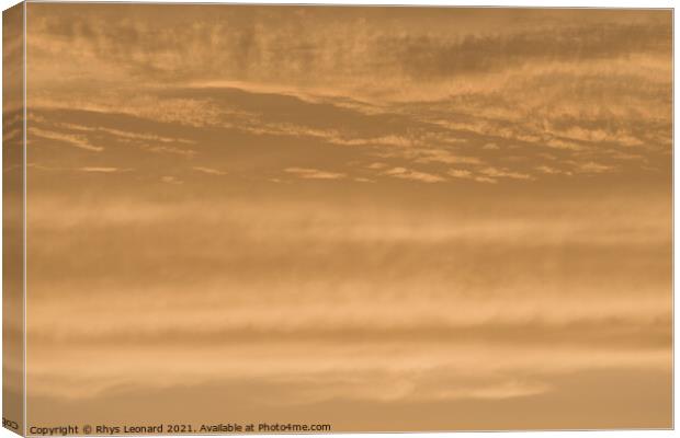 Abstract sky background of deep golden sunset clouds. Full frame Canvas Print by Rhys Leonard
