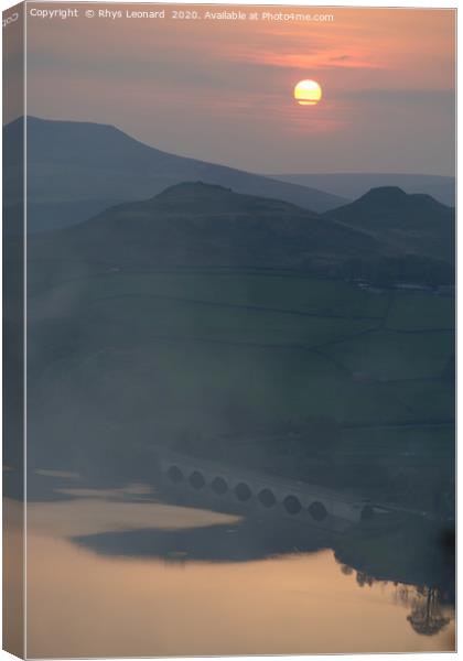 Misty orange sunset over Ladybower reservoir Canvas Print by Rhys Leonard