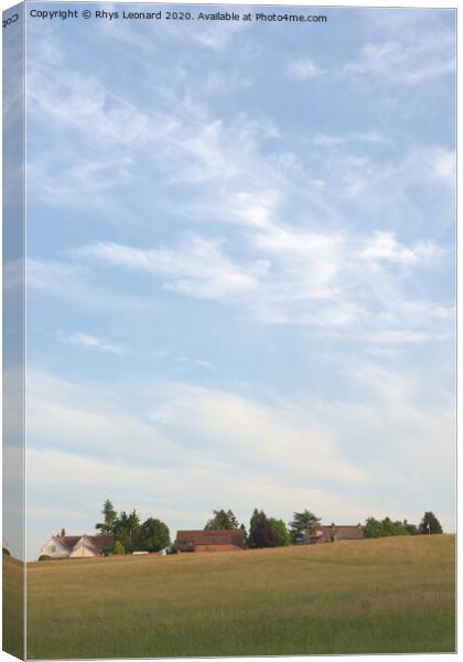 Rural houses on the edge of hayesbank common, in Great Malvern, Worcestershire. Focus on clouds Canvas Print by Rhys Leonard