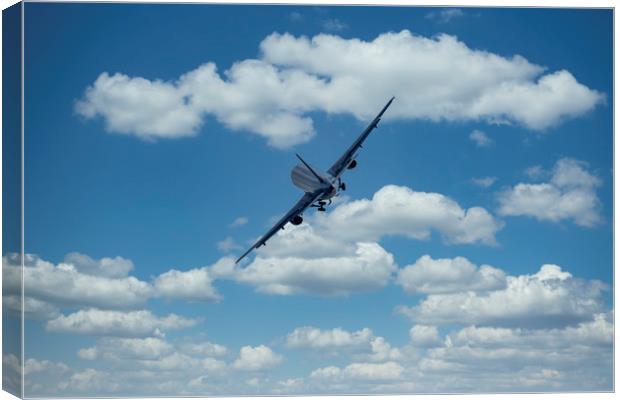 Passenger airplane on a cloudy sky Canvas Print by Arpad Radoczy