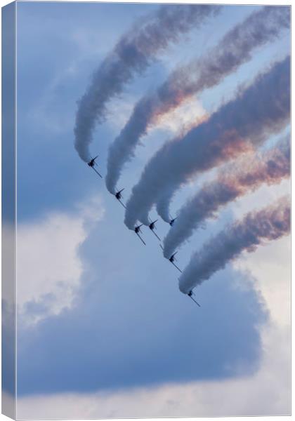 Flying demonstration with colored smoke Canvas Print by Arpad Radoczy